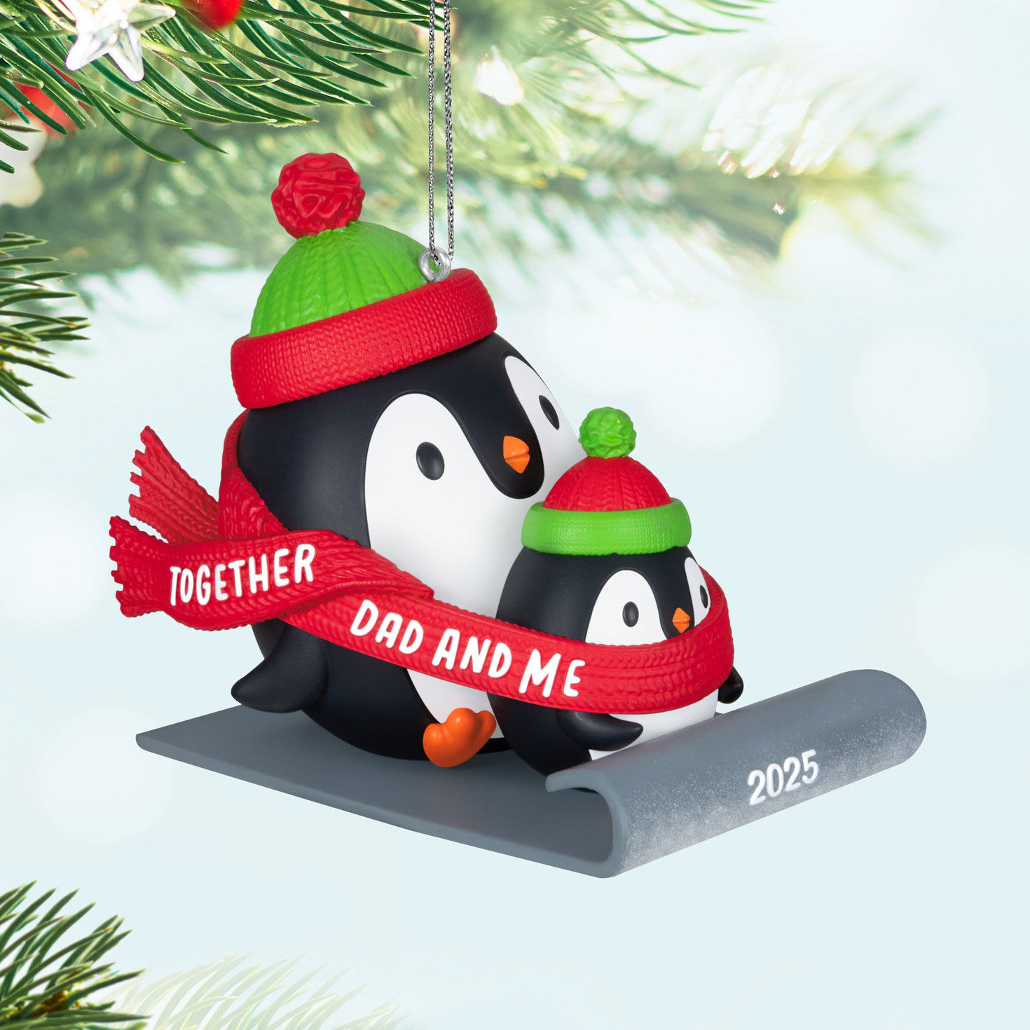 Dad & Me Penguins Sledding 2025 Keepsake Ornament hanging on tree image number 2