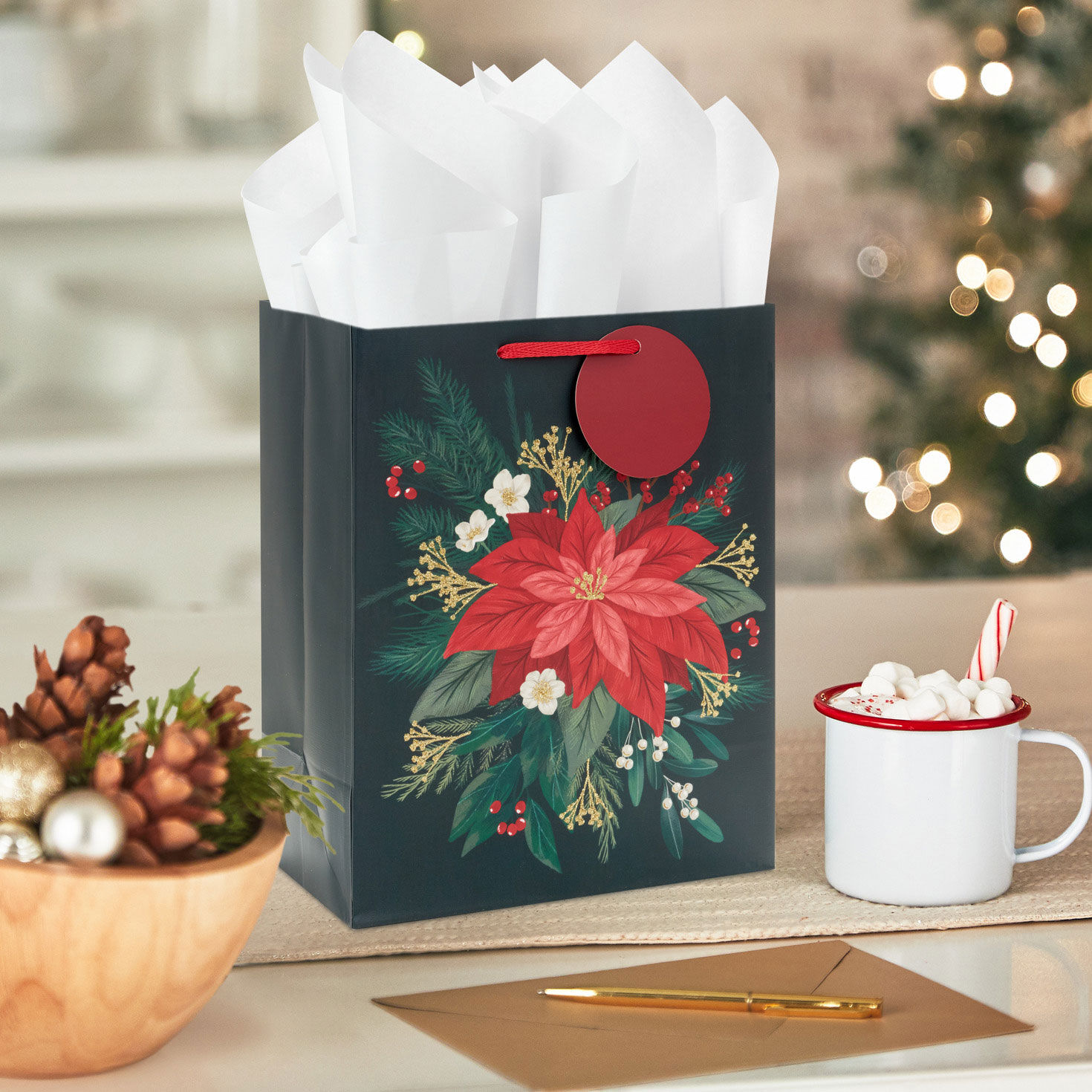 Red Poinsettia on Black Medium Christmas Gift Bag in use image number 2