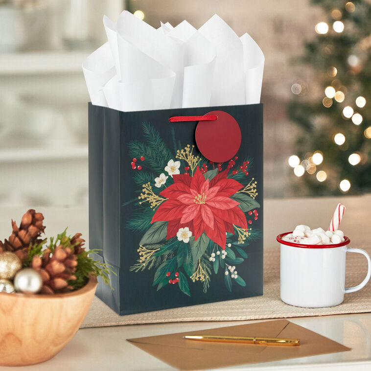 Red Poinsettia on Black Medium Christmas Gift Bag in use image number 2