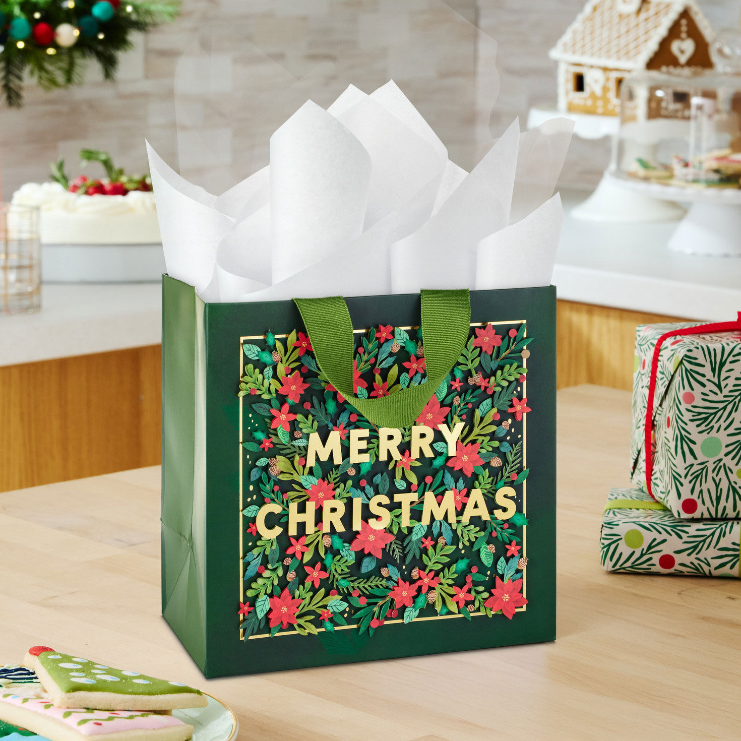 Red Poinsettias on Green Square Holiday Gift Bag in use image number 2