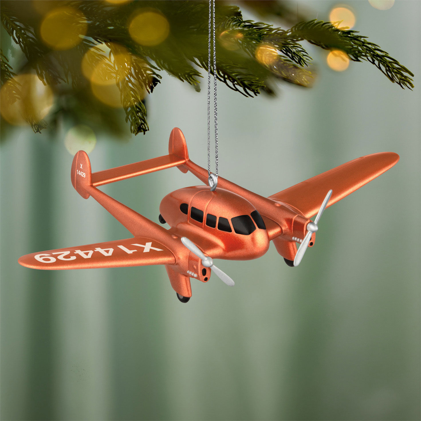 Copper Airplane Keepsake Ornament hanging on tree image number 2