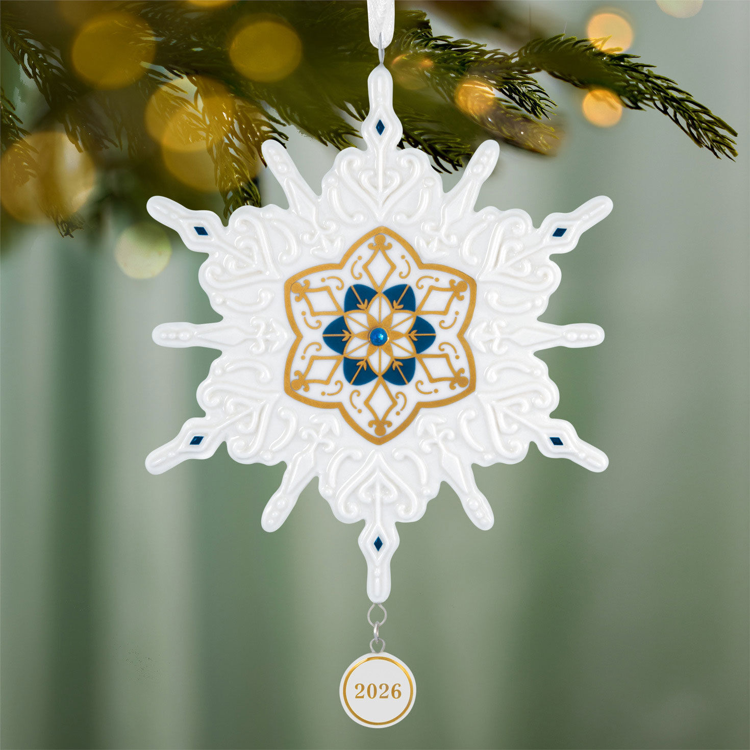 White Snowflake With Blue, Gold Keepsake Ornament hanging on tree image number 2
