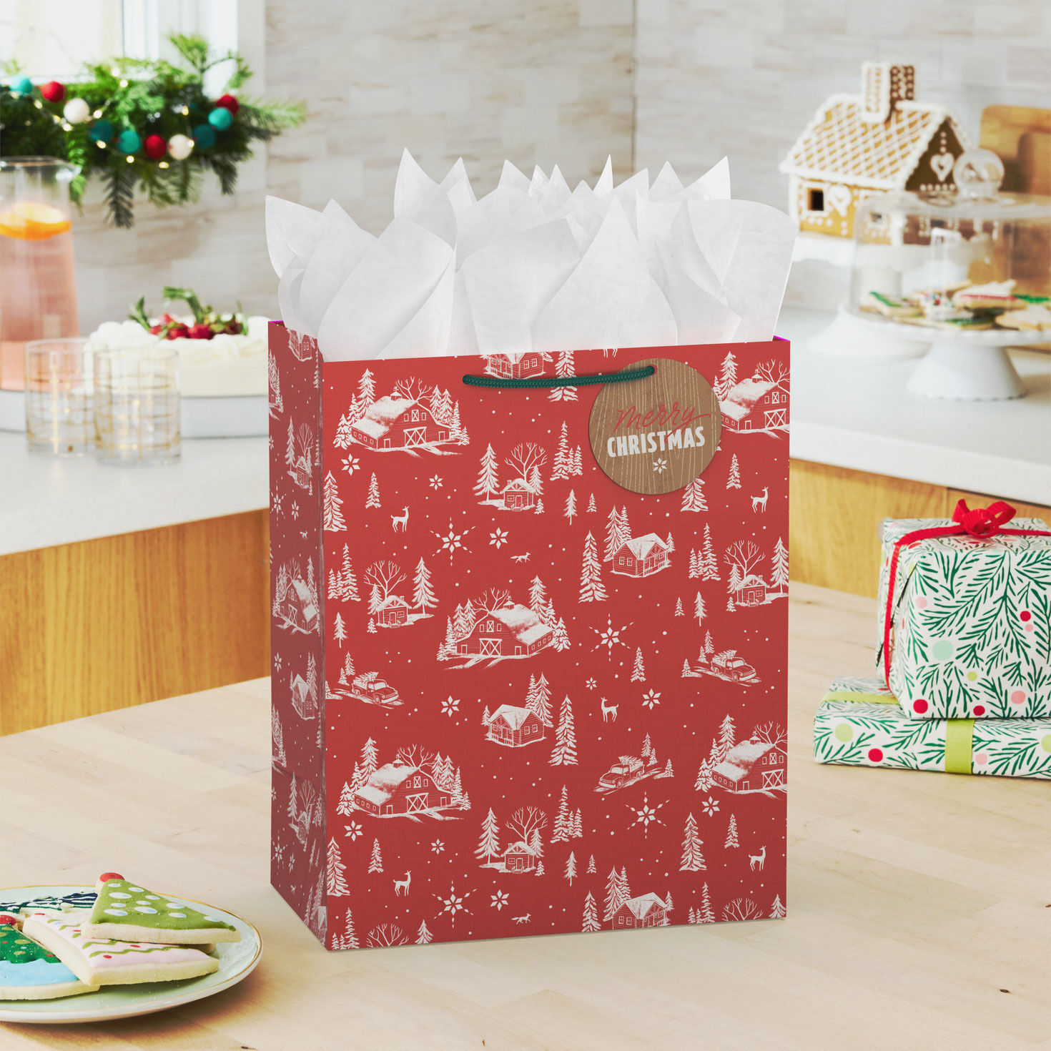 Snowy Farmhouses on Red Large Holiday Gift Bag In use image number 2