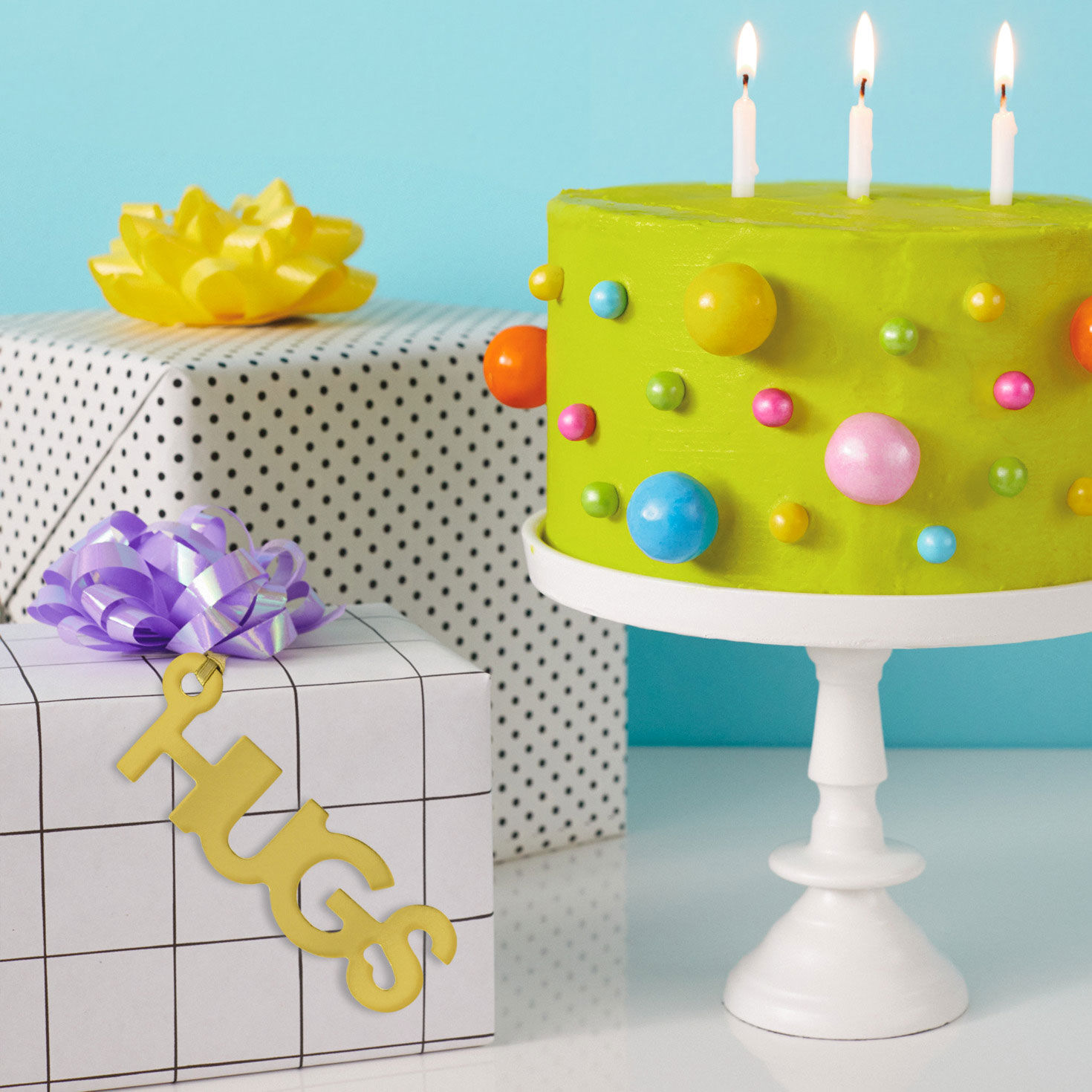 Hugs Die-Cut Gold Gift Trim With Ribbon Hanger in use image number 2