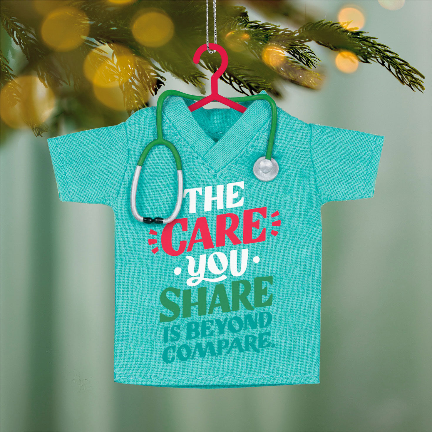 The Care You Share Scrubs Shirt Keepsake Ornament hanging on tree image number 2