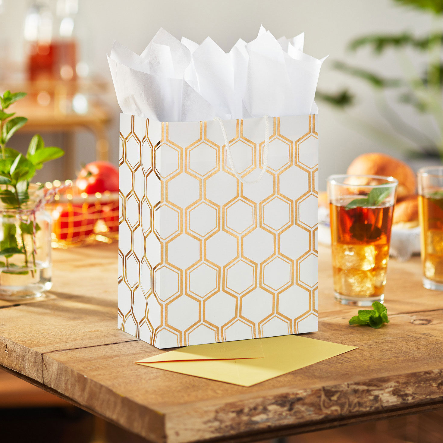 Gold Foil Honeycomb on White Medium Gift Bag in use image number 2