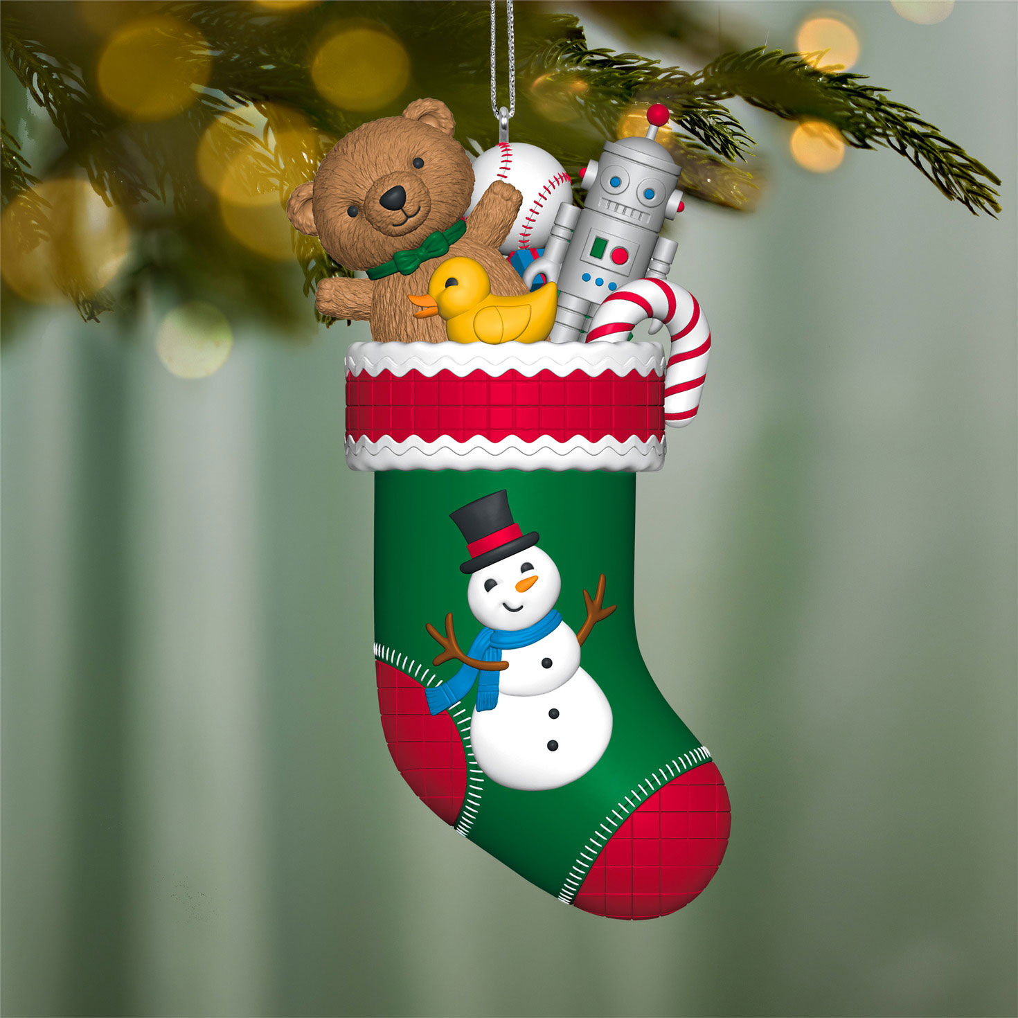 Snowman Stocking With Toys Keepsake Ornament hanging on tree image number 2