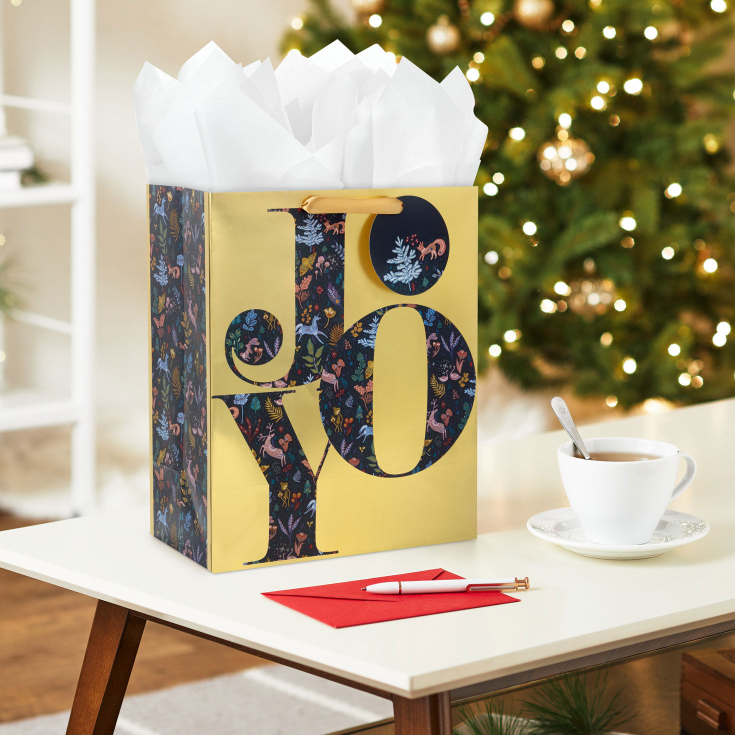 Joy on Metallic Gold Large Christmas Gift Bag In Use image number 2