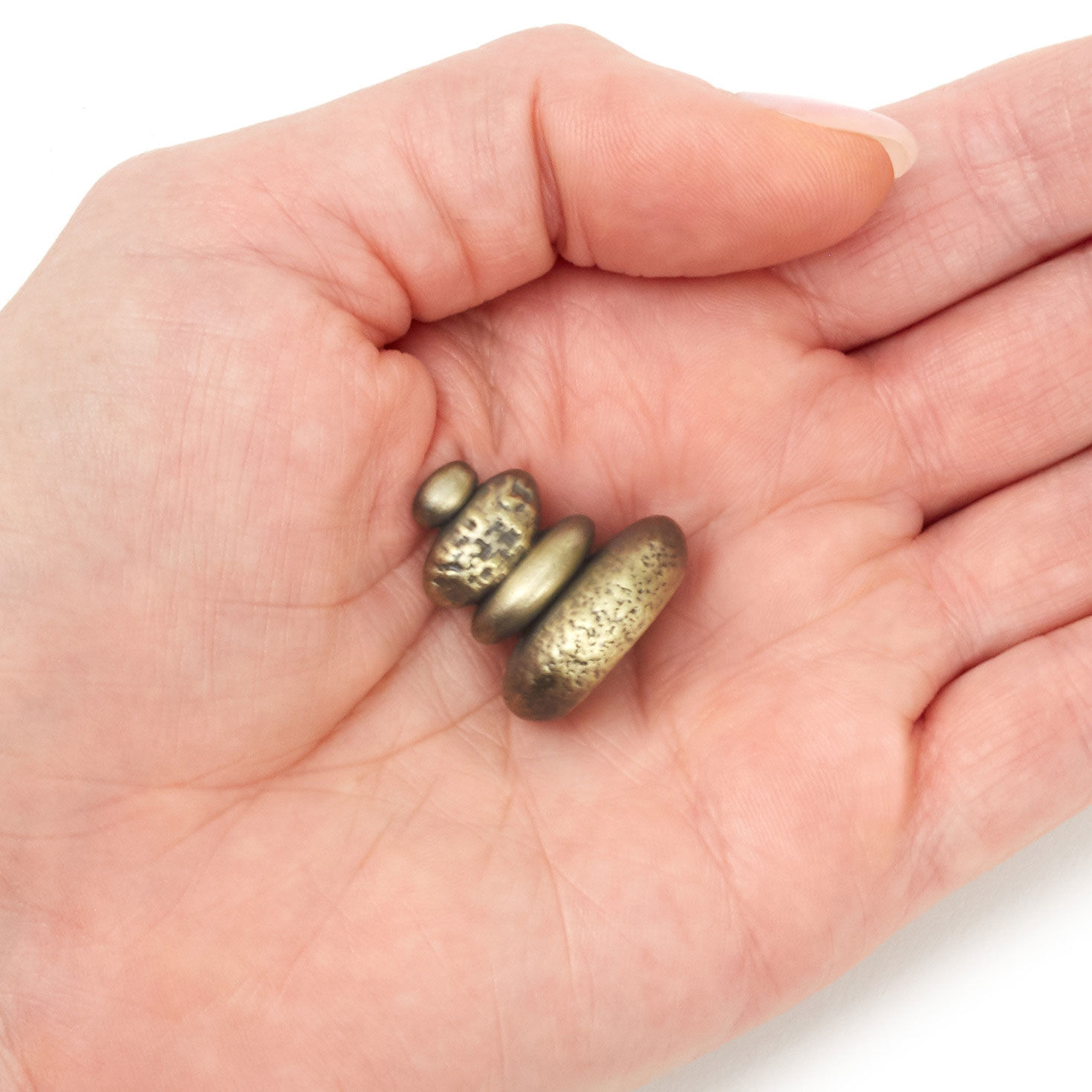 Gold Stacked Stones Metal Pocket Token hand holding item image number 3