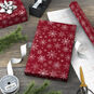 Snowflakes on Red Christmas Wrapping Paper Roll in use image number 3