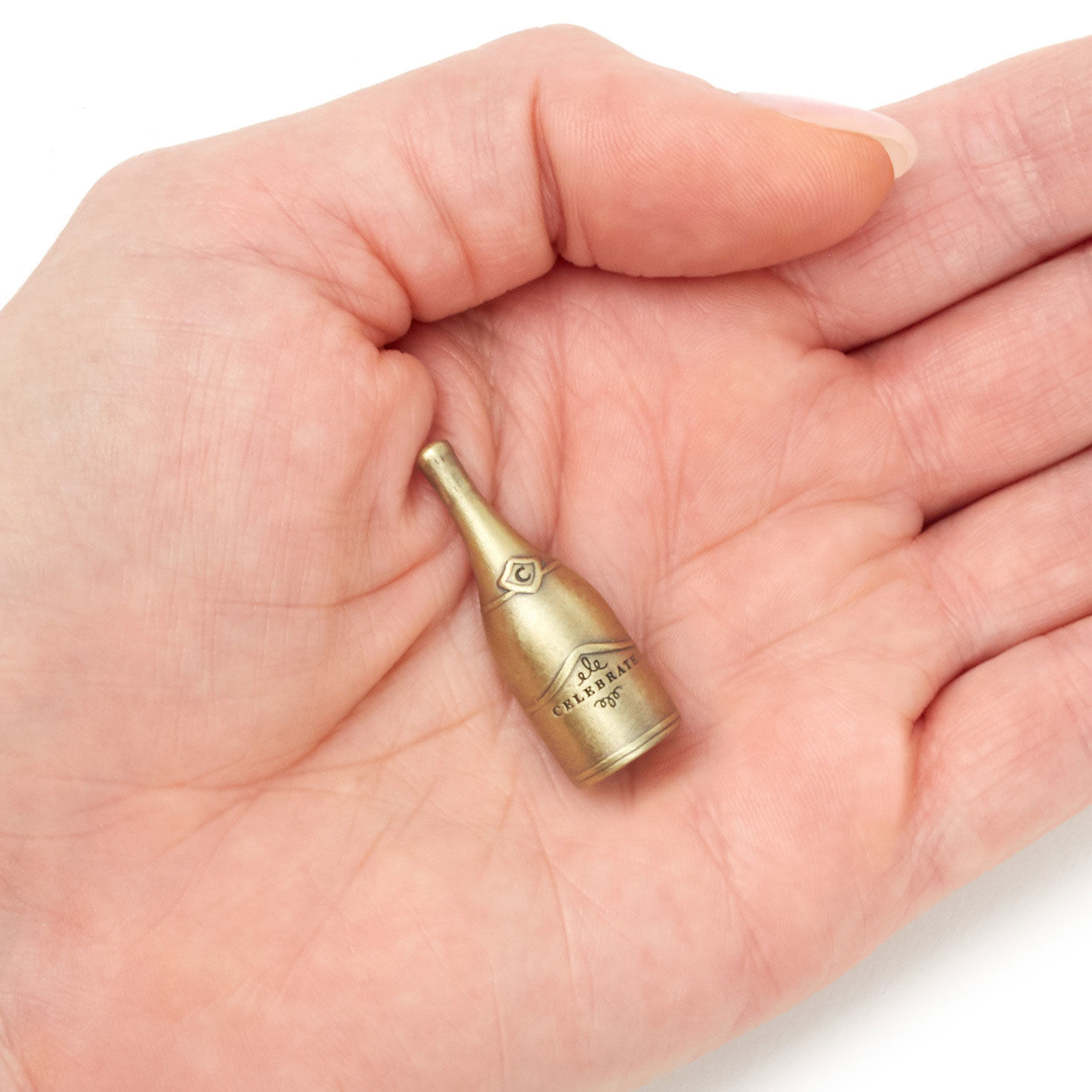 Celebrate Champagne Bottle Metal Pocket Token hand holding item image number 3