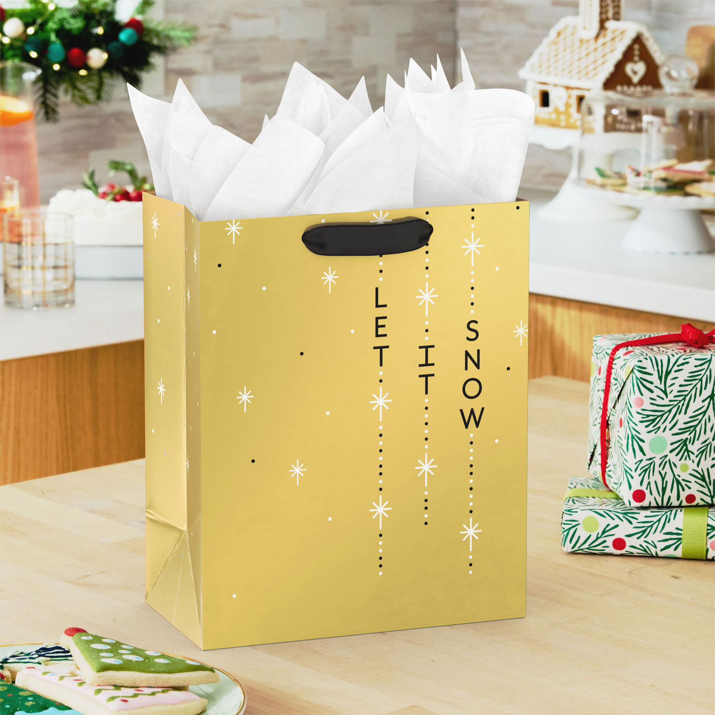 Let It Snow on Gold Medium Holiday Gift Bag In use image number 2
