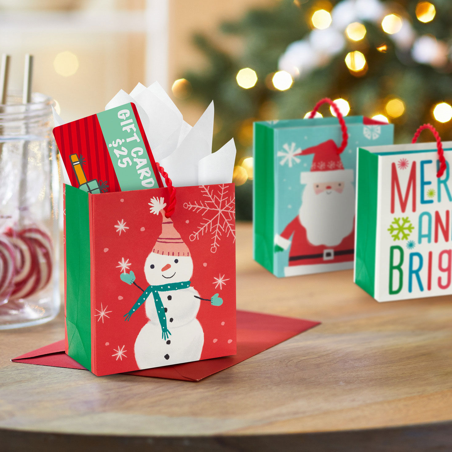 Merry and Bright 3-Pack Christmas Gift Card Bags In use image number 2