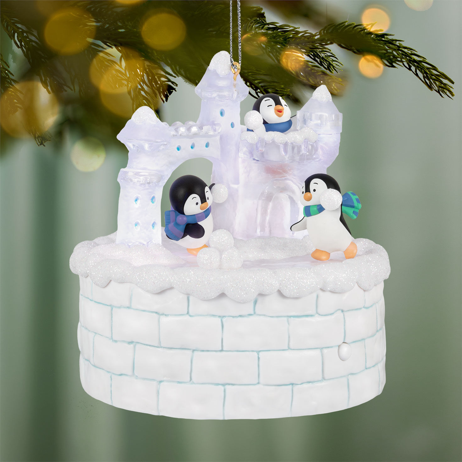 Penguins on Ice Castle Keepsake Ornament hanging on tree image number 2
