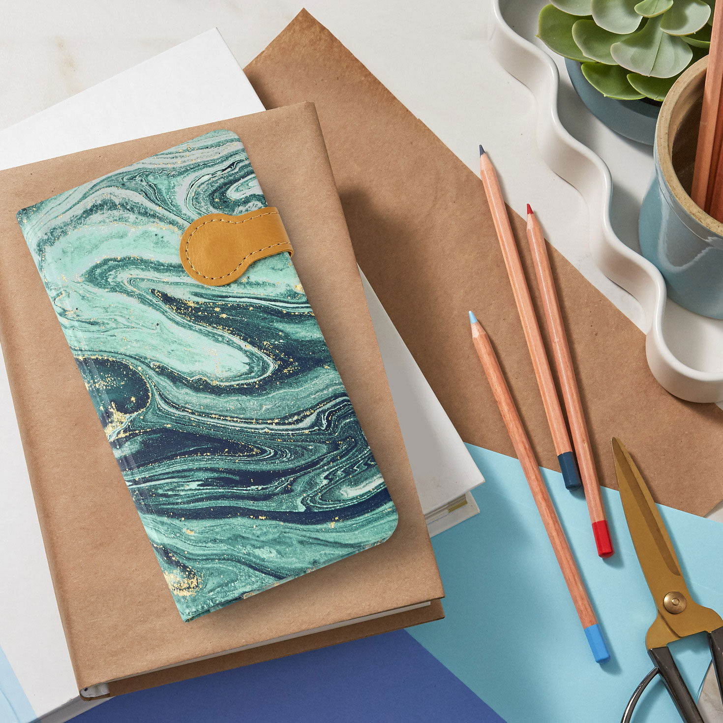Marbled Blue and Gold Hardcover Slim Journal in use image number 6