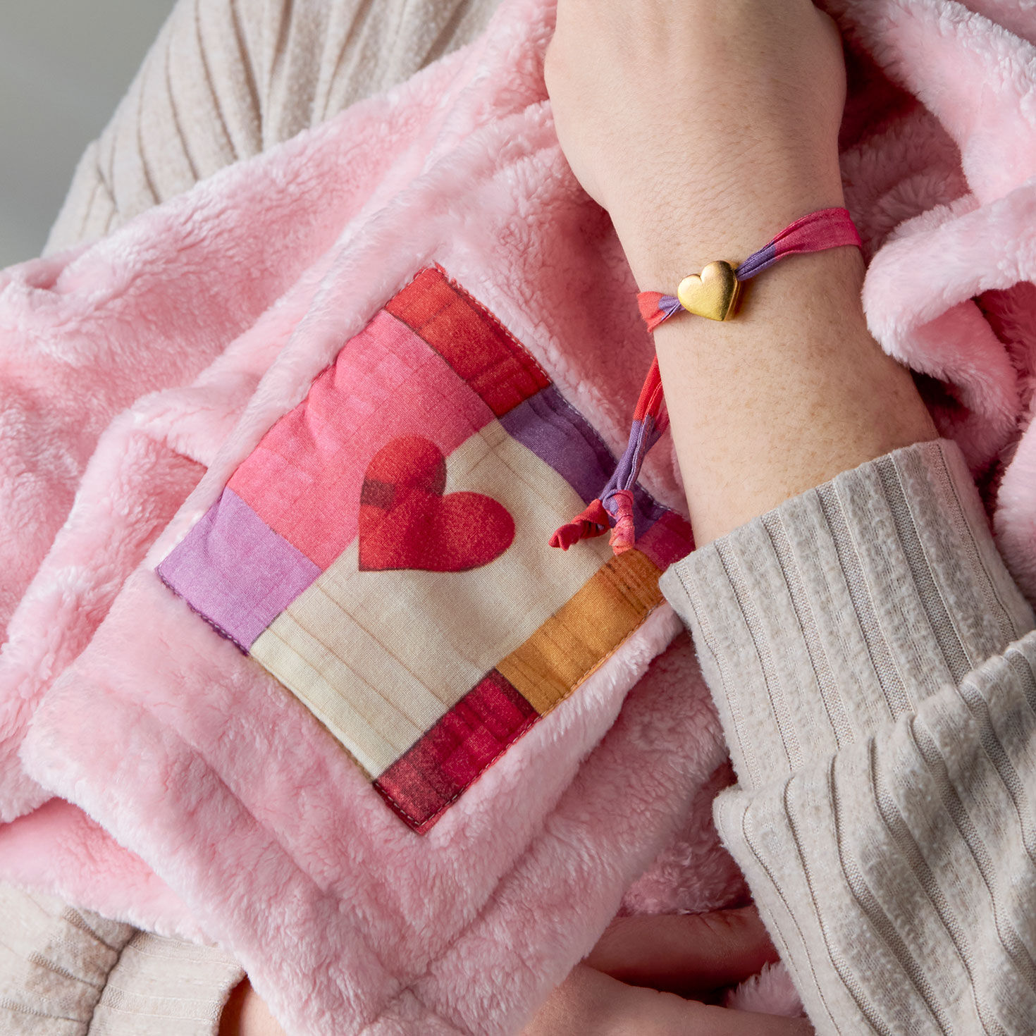 Pink Plush Blanket With Heart Patch and Bracelet Set in use image number 3