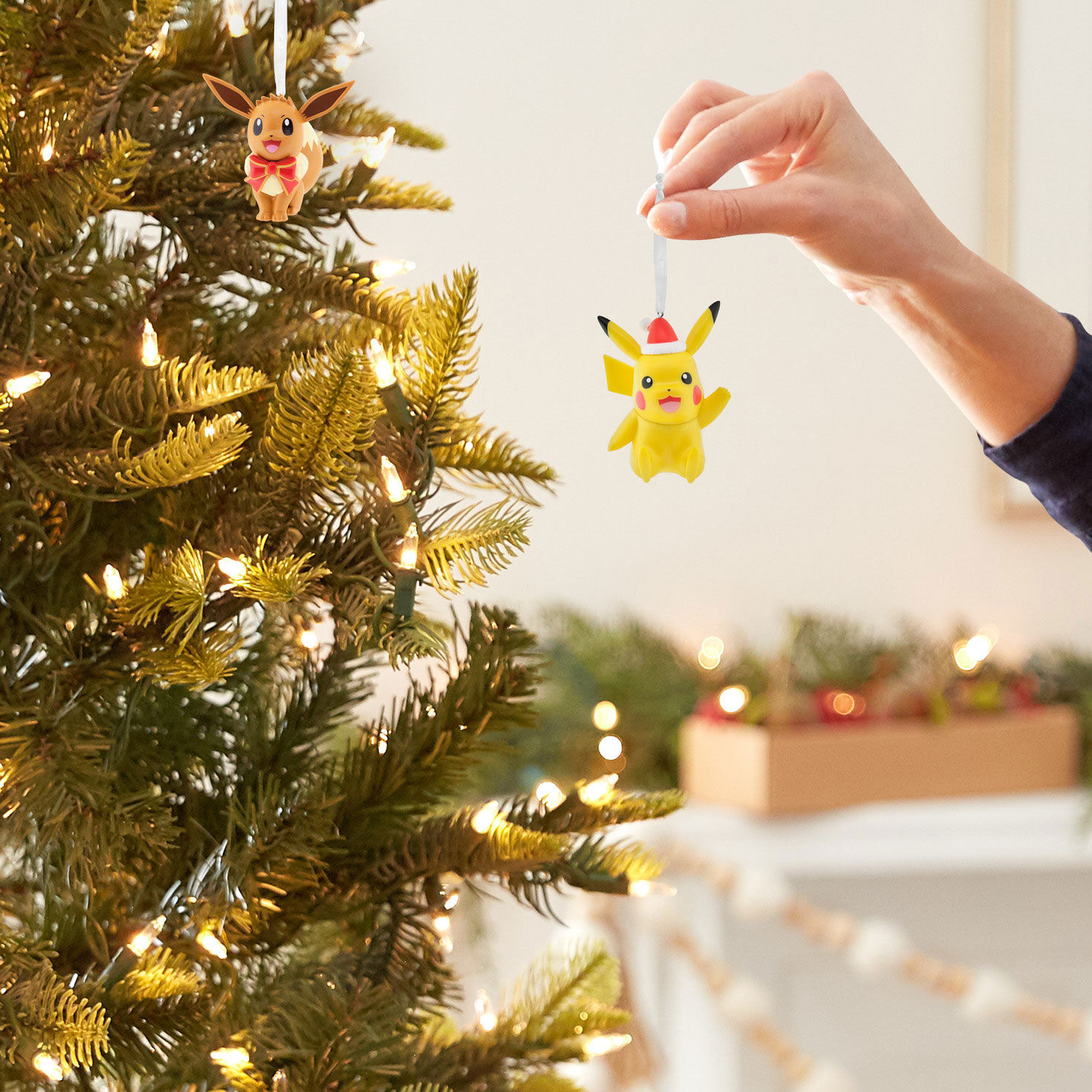 Pok&eacute;mon Pikachu and Eevee Christmas Ornaments hand holding item image number 7