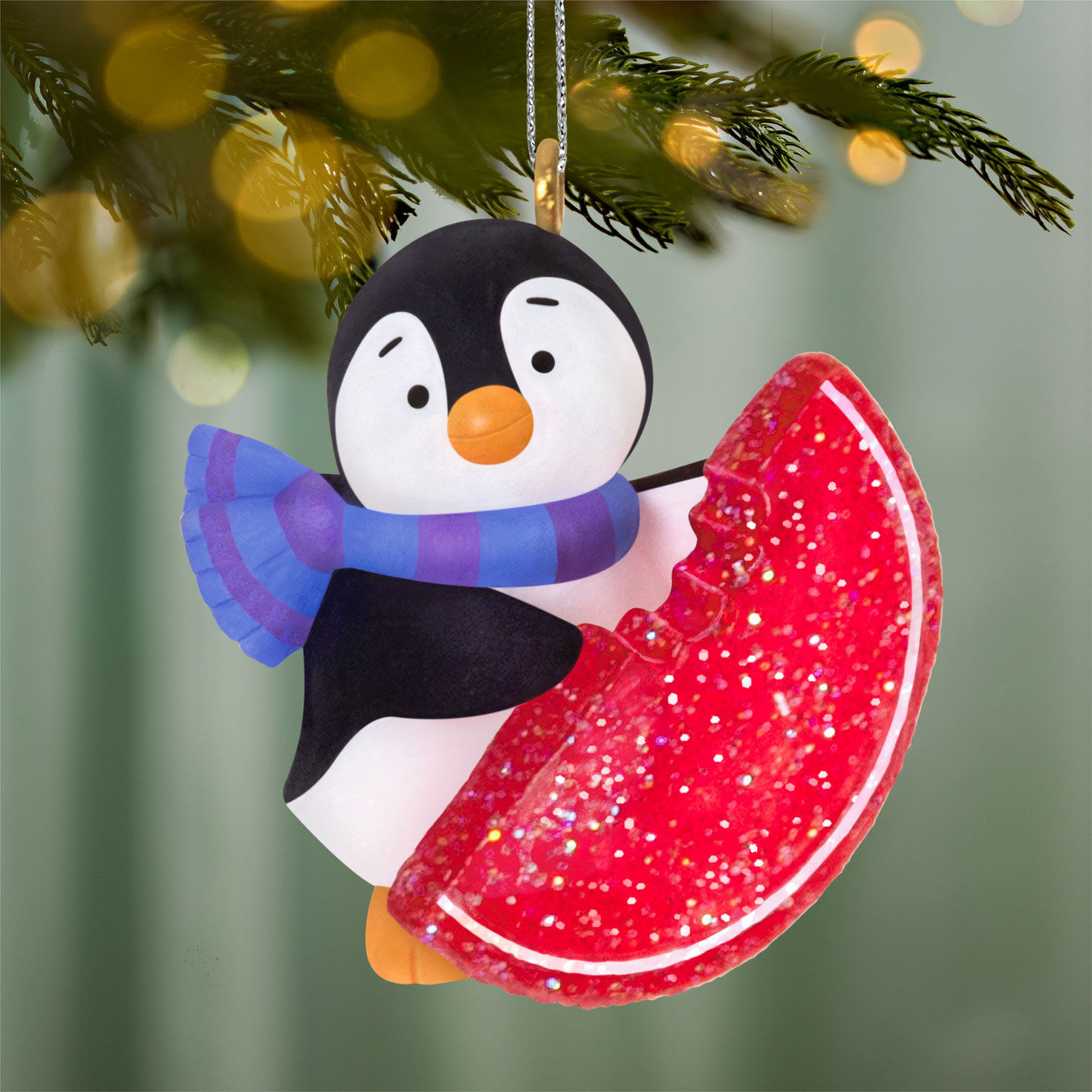Penguin With Fruit Slice Candy Keepsake Ornament hanging on tree image number 2