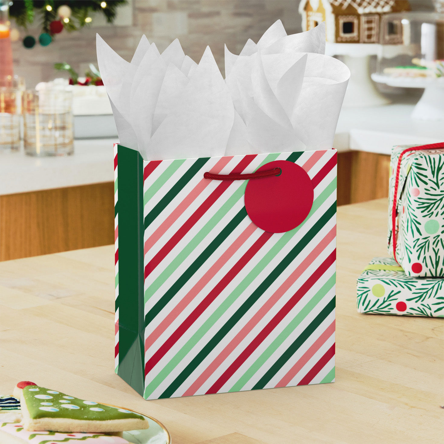 Pink and Green Stripes Holiday Gift Bag with Tissue in use image number 2