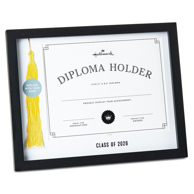 A black frame with a white diploma and a yellow graduation tassel inside
