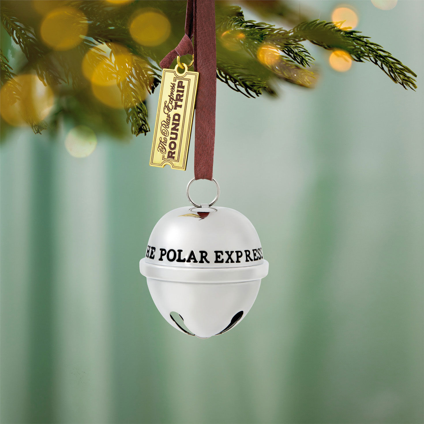 Polar Express Silver Sleigh Bell Keepsake Ornament hanging on tree image number 2