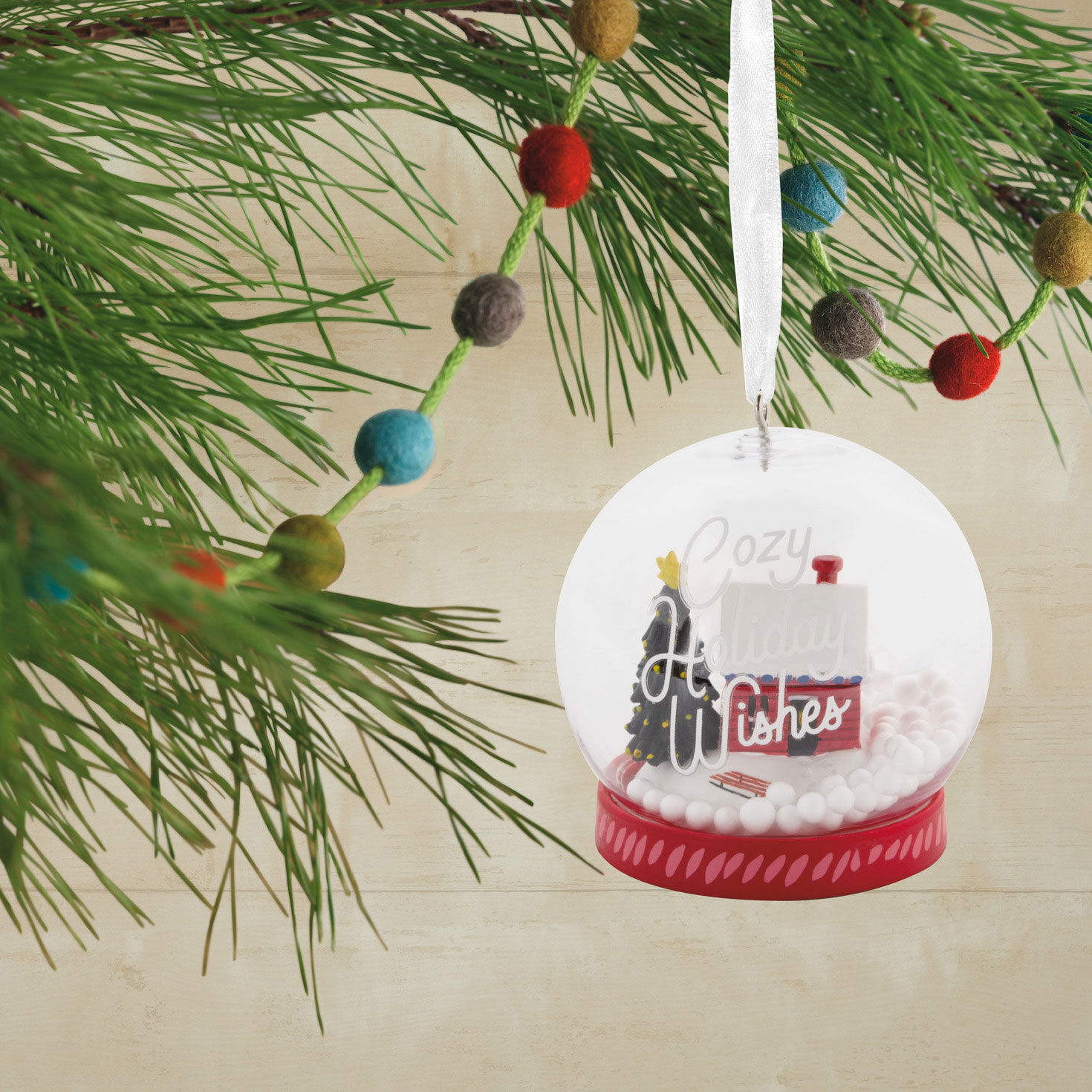 Holiday Wishes Snow Globe Christmas Ornament hanging on tree image number 2