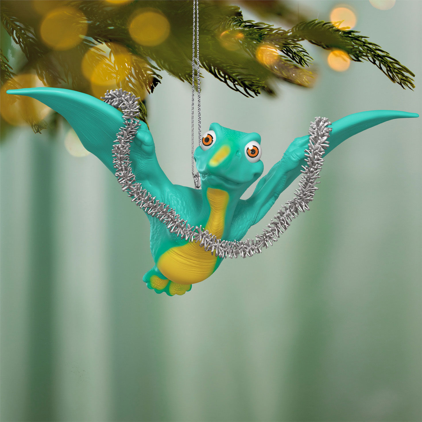 Flying Dinosaur With Garland Keepsake Ornament hanging on tree image number 2