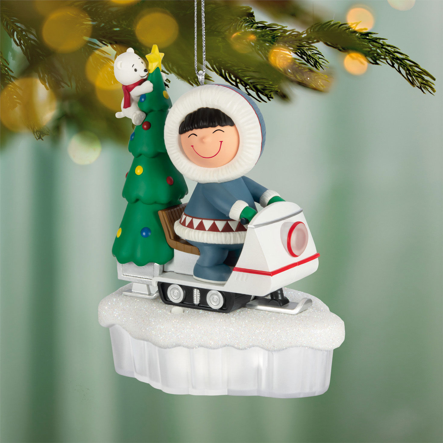Eskimo and Tree on Snowmobile Keepsake Ornament hanging on tree image number 2