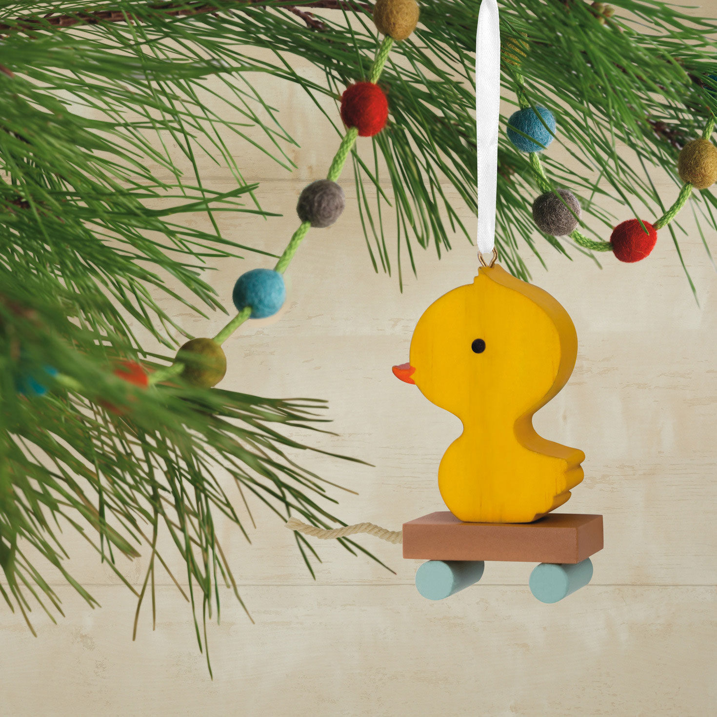 Yellow Duck Pull Toy Christmas Ornament Hanging on tree image number 2