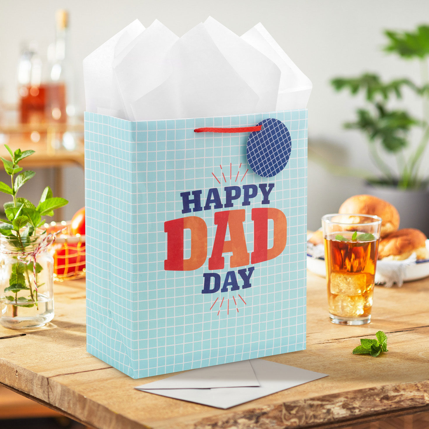 Blue Grid Large Father's Day Gift Bag With Tissue in use image number 2