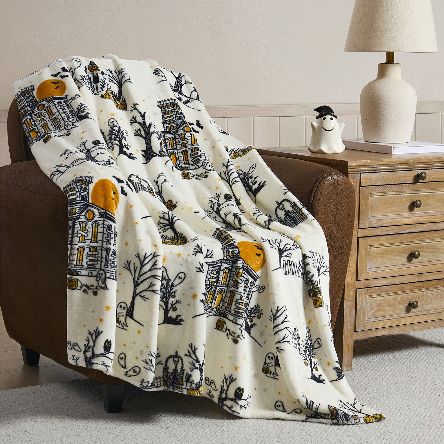 Hallmark Multicolor 50" x 70" Plush Halloween Throw Blanket in use image number 5