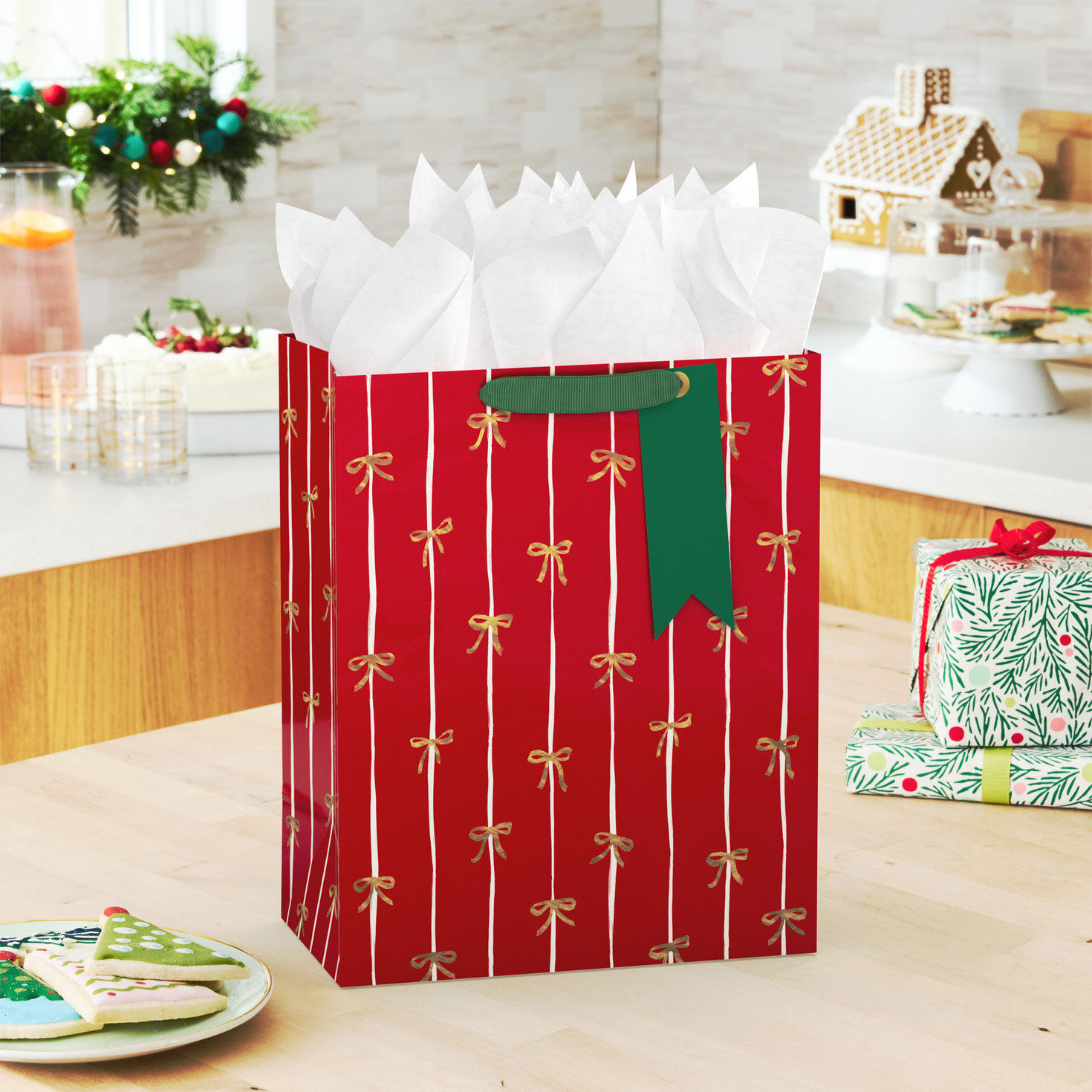 Red and White Stripes Gold Bows Holiday Gift Bag in use image number 2