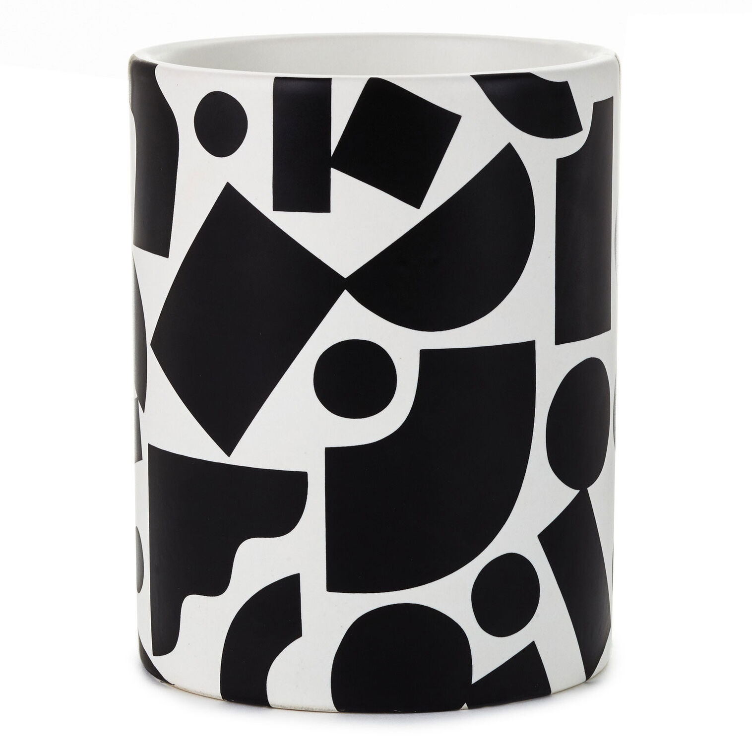 A black and white pencil holder with geometric shapes