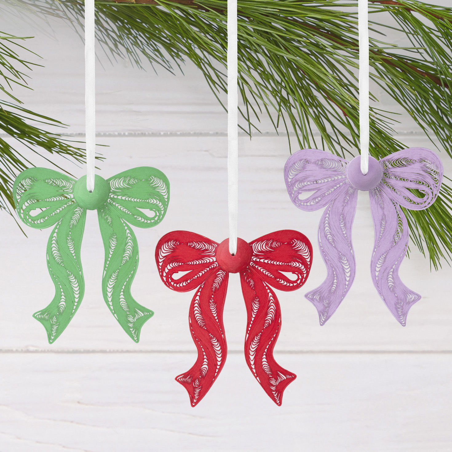 4 Bow Quilled Paper Christmas Ornaments hanging on tree image number 2
