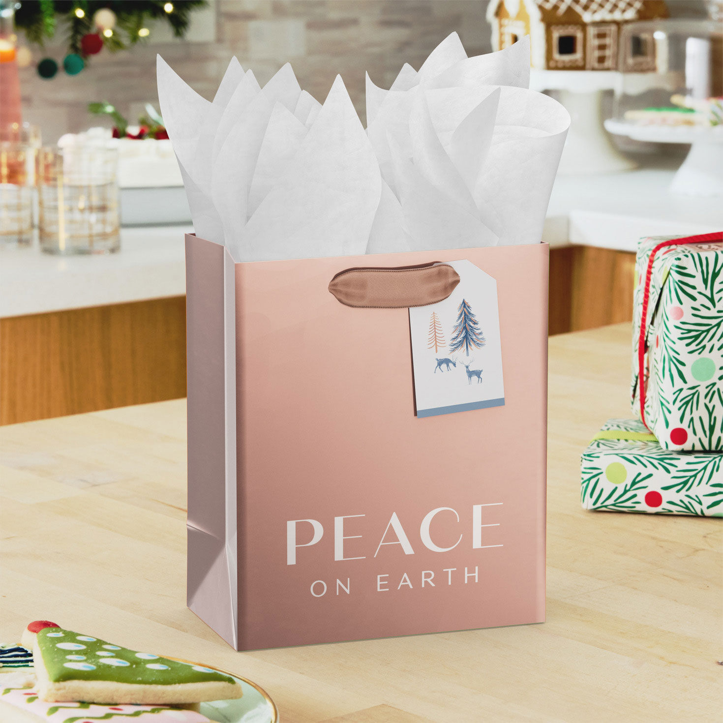 Peace on Earth Rose Gold Small Holiday Gift Bag in use image number 2