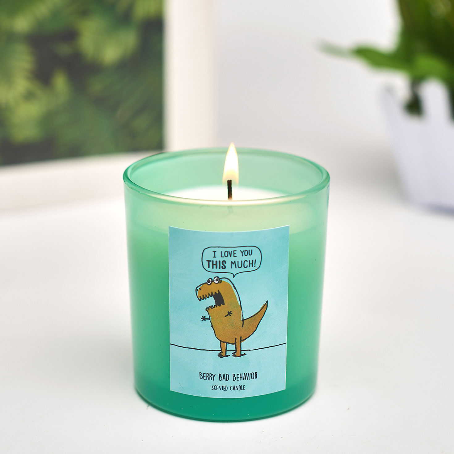 Berry-Scented T-Rex Candle in Green Glass Jar in use image number 5
