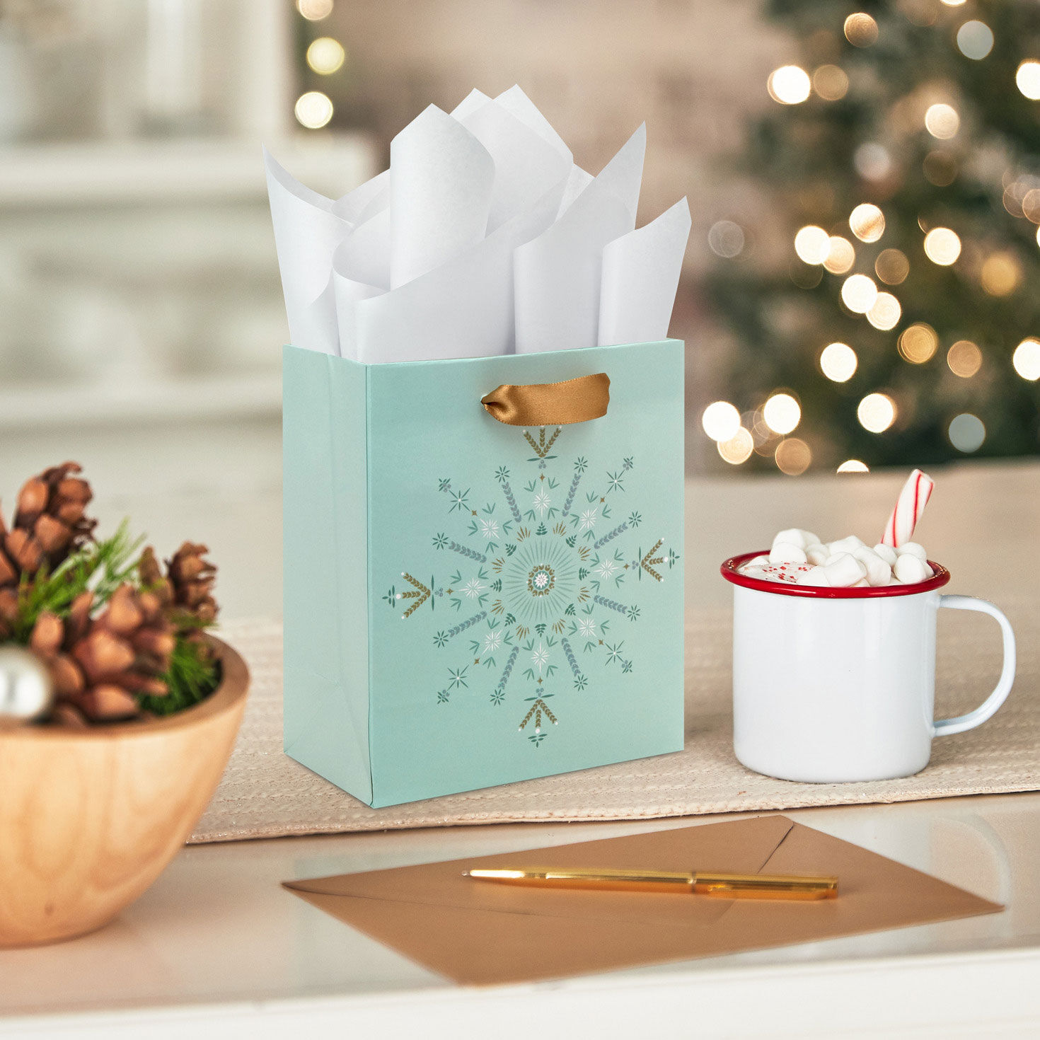 Snowflake Star on Light Sage Small Holiday Gift Bag In use image number 2