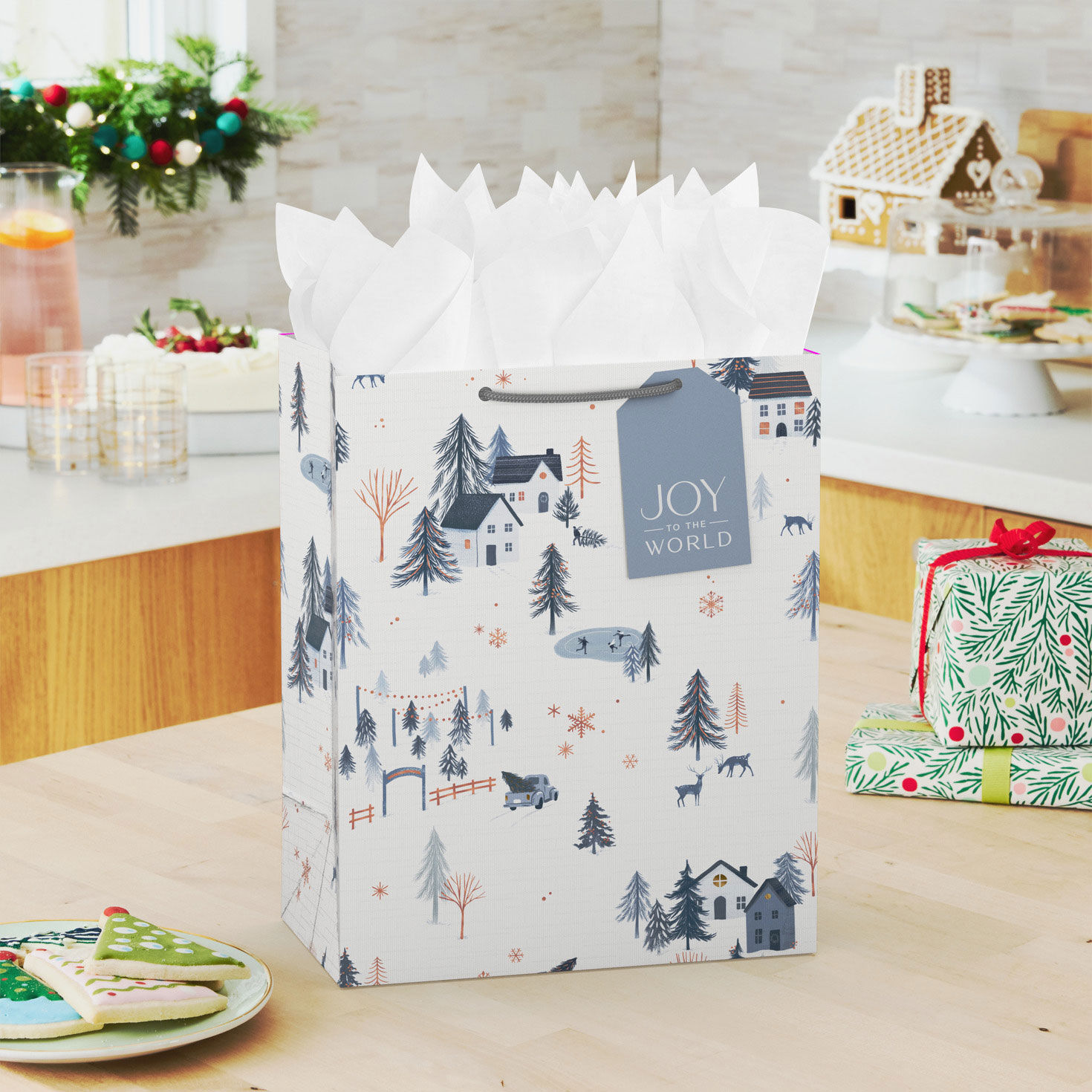 Snowy Blue Village on White Large Holiday Gift Bag In use image number 2
