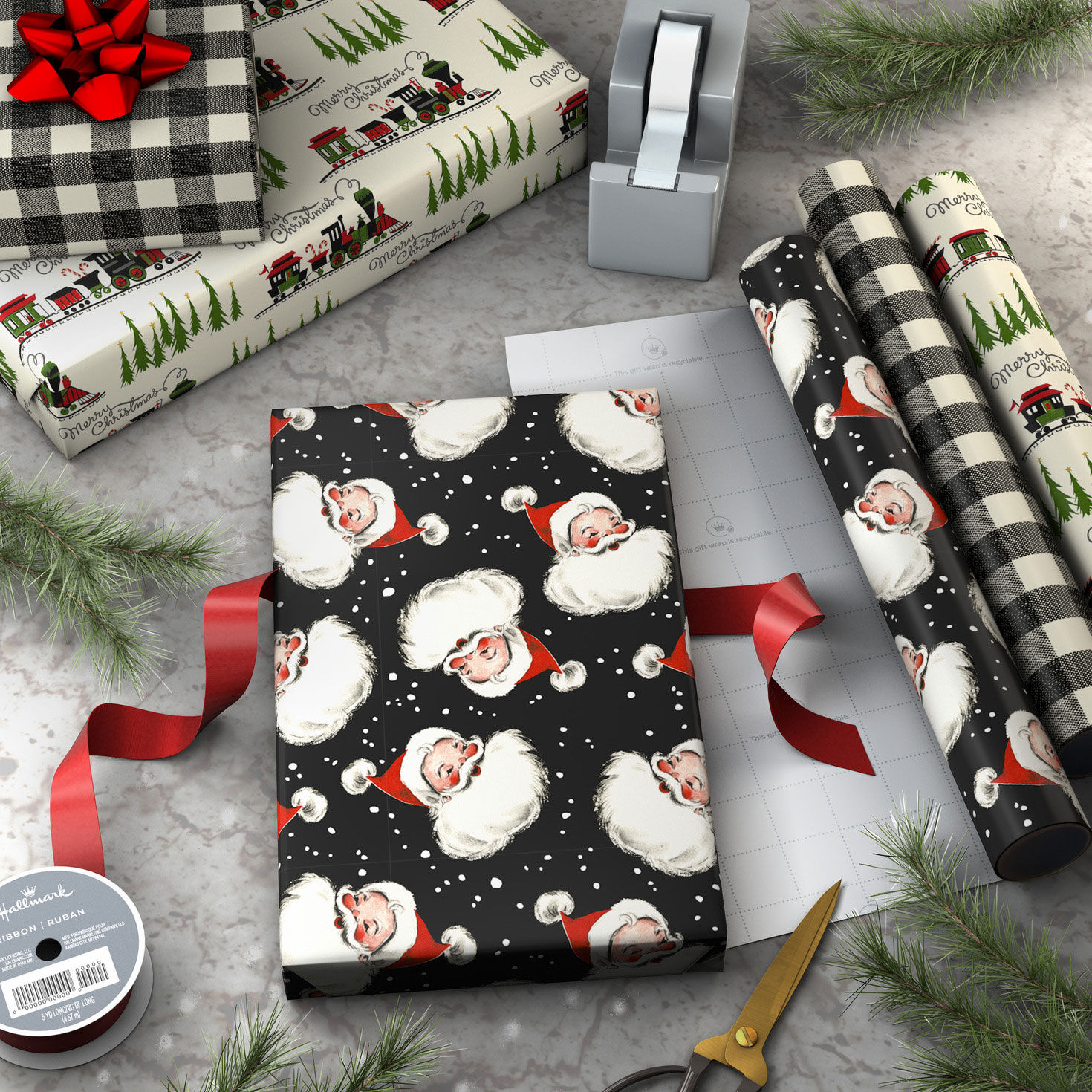 Santa on Black 3-Pack Mini Xmas Gift Wrap Rolls in use image number 3