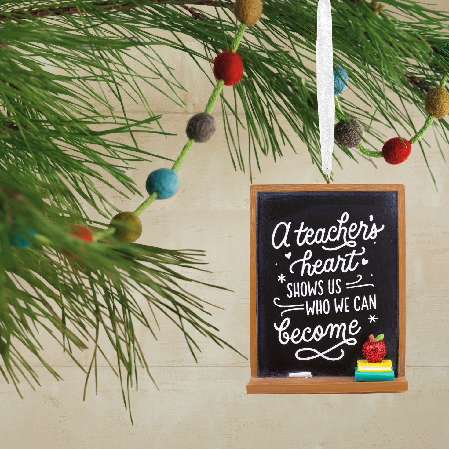 A Teacher's Heart Blackboard Christmas Ornament hanging on tree image number 2