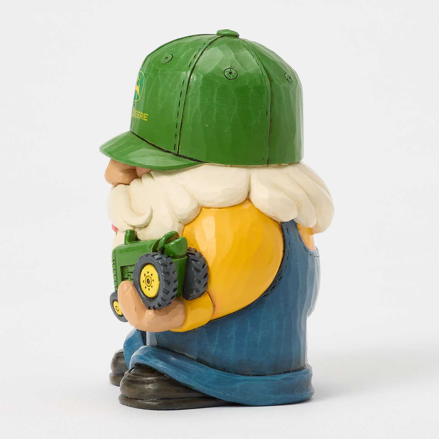 Gnome in John Deere Cap Holding Tractor Figurine side image number 3