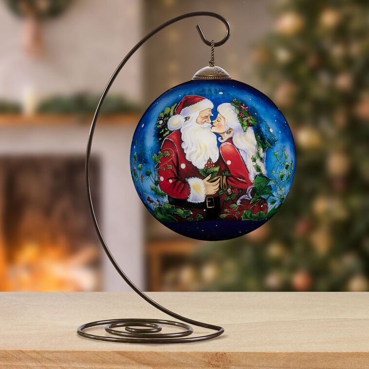 Santa and Mrs. Claus Kissing Blown Glass Ornament in use image number 4