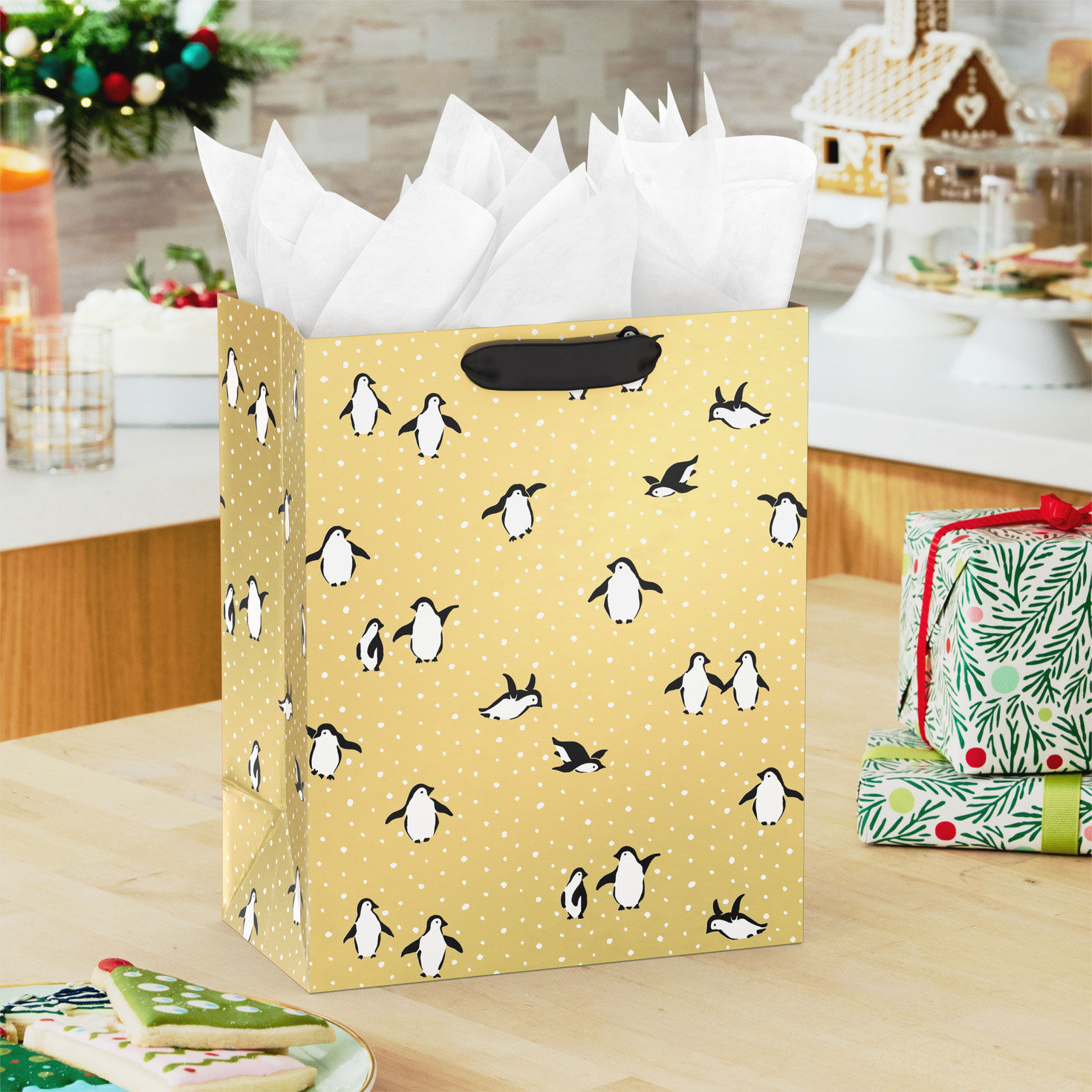 Penguins on Gold Medium Holiday Gift Bag In use image number 2