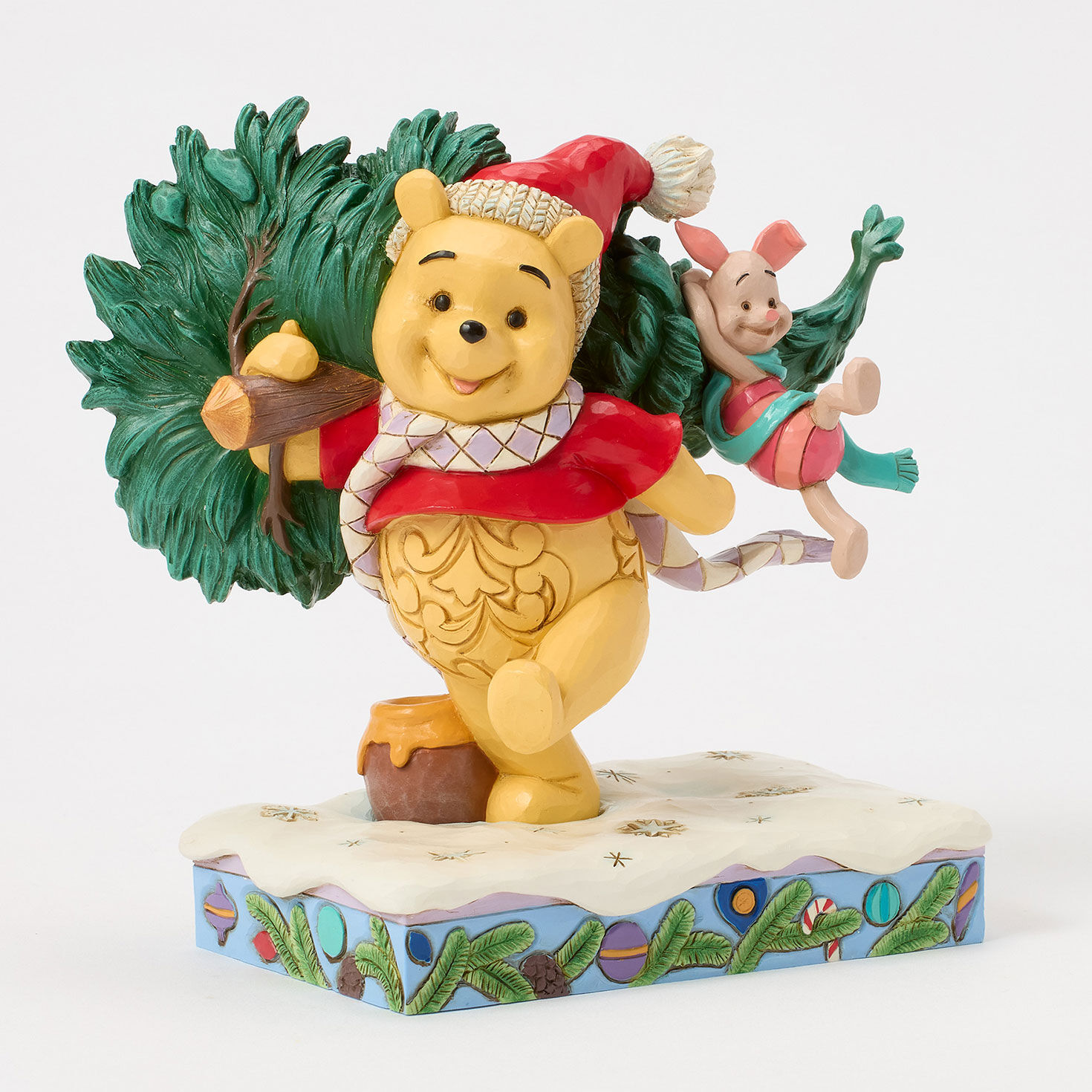 Jim Shore Pooh Carrying Christmas Tree Figurine angled image number 3