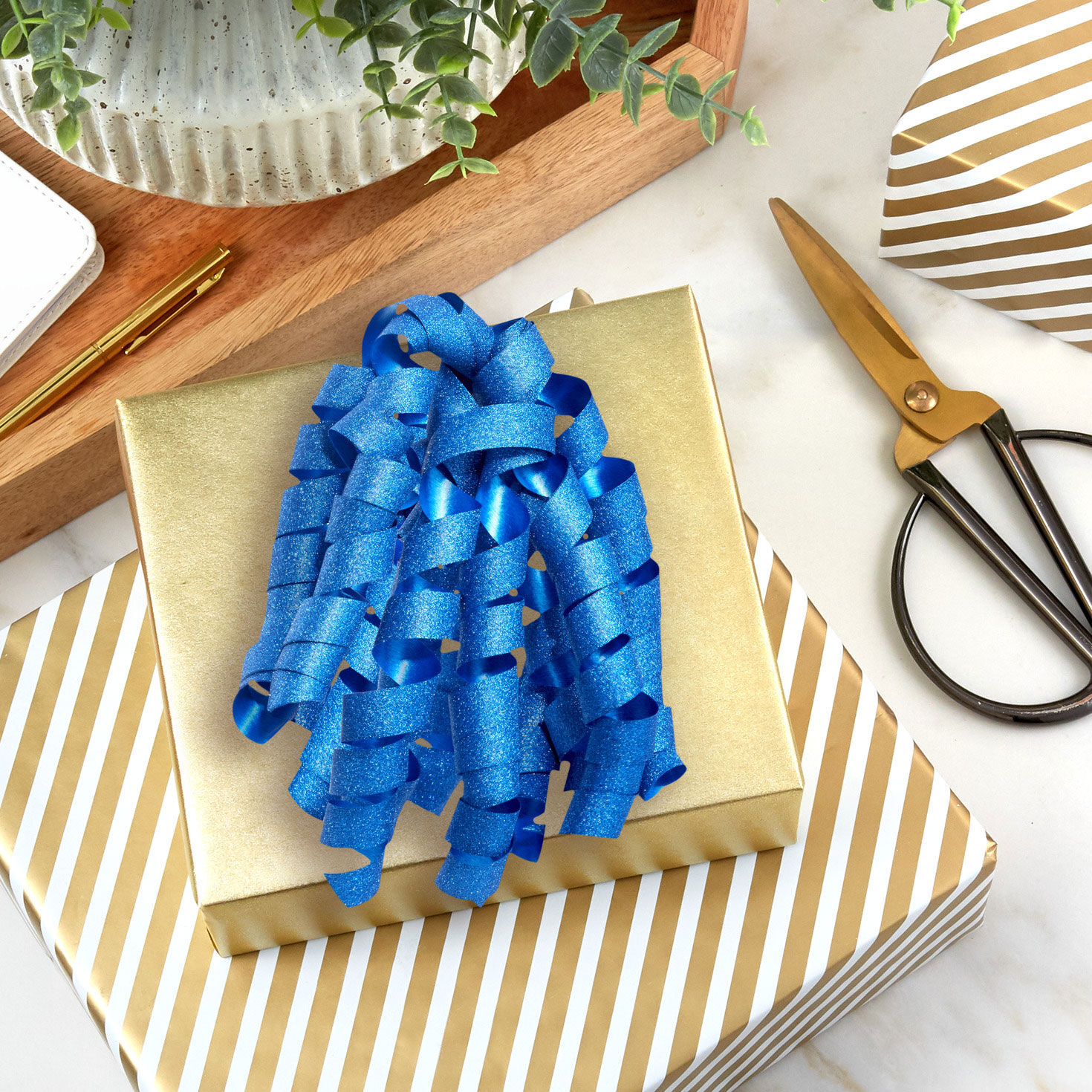 Sparkly Blue Curly Ribbon Gift Bow in use image number 2