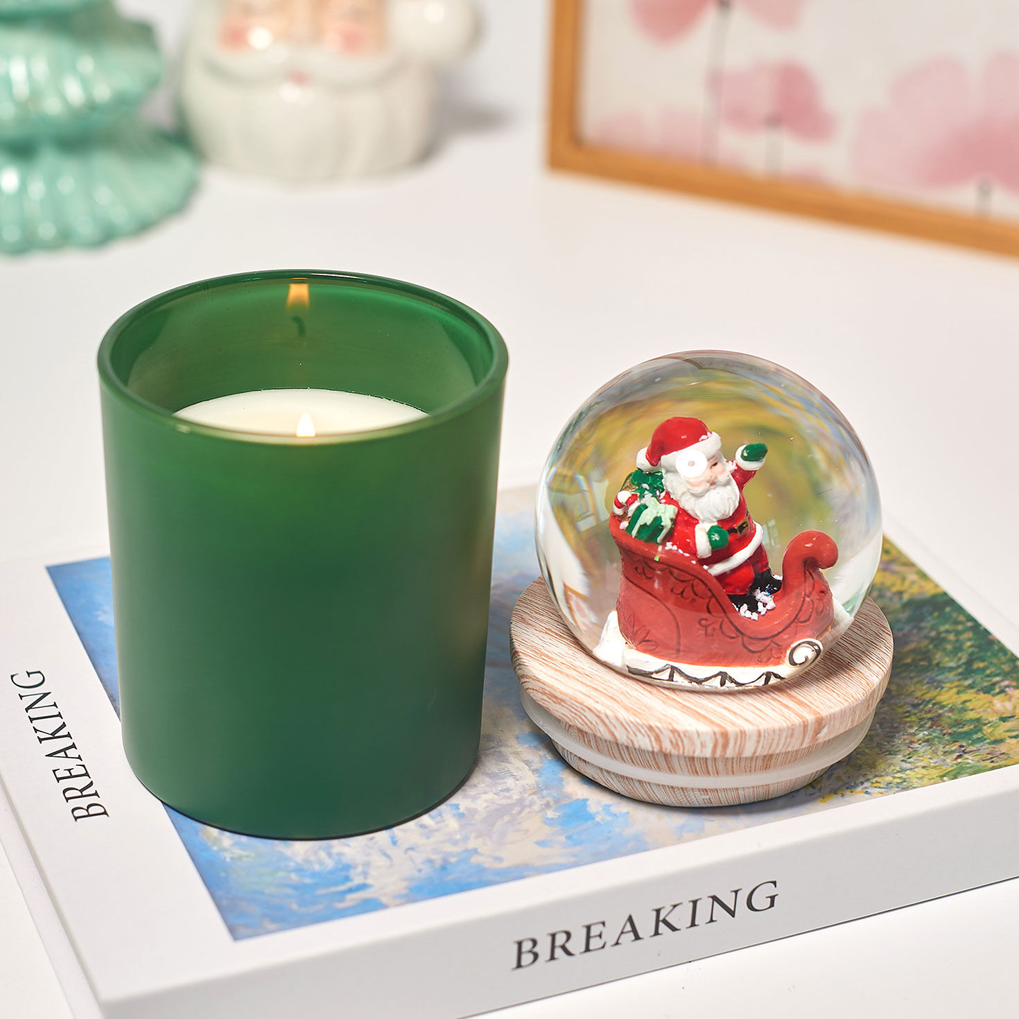 Green Under Mistletoe Candle Santa Sleigh Snow Globe in use image number 4