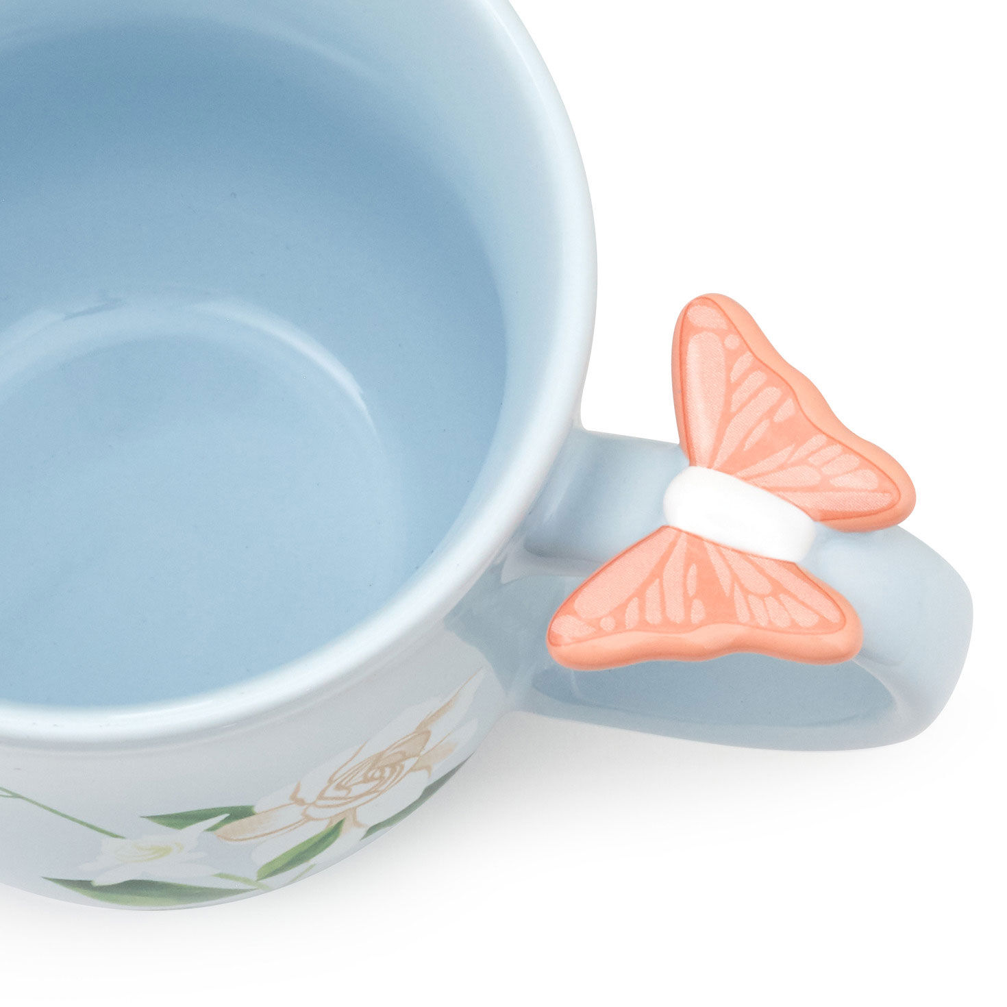White Mug With Flowers and Butterfly Thumb Rest inside mug image number 3