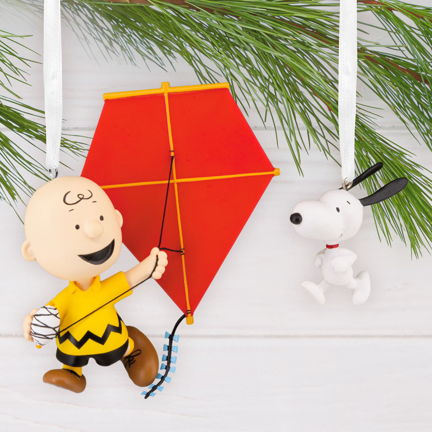 Charlie Brown Snoopy Flying Kit Christmas Ornaments hanging on tree image number 5