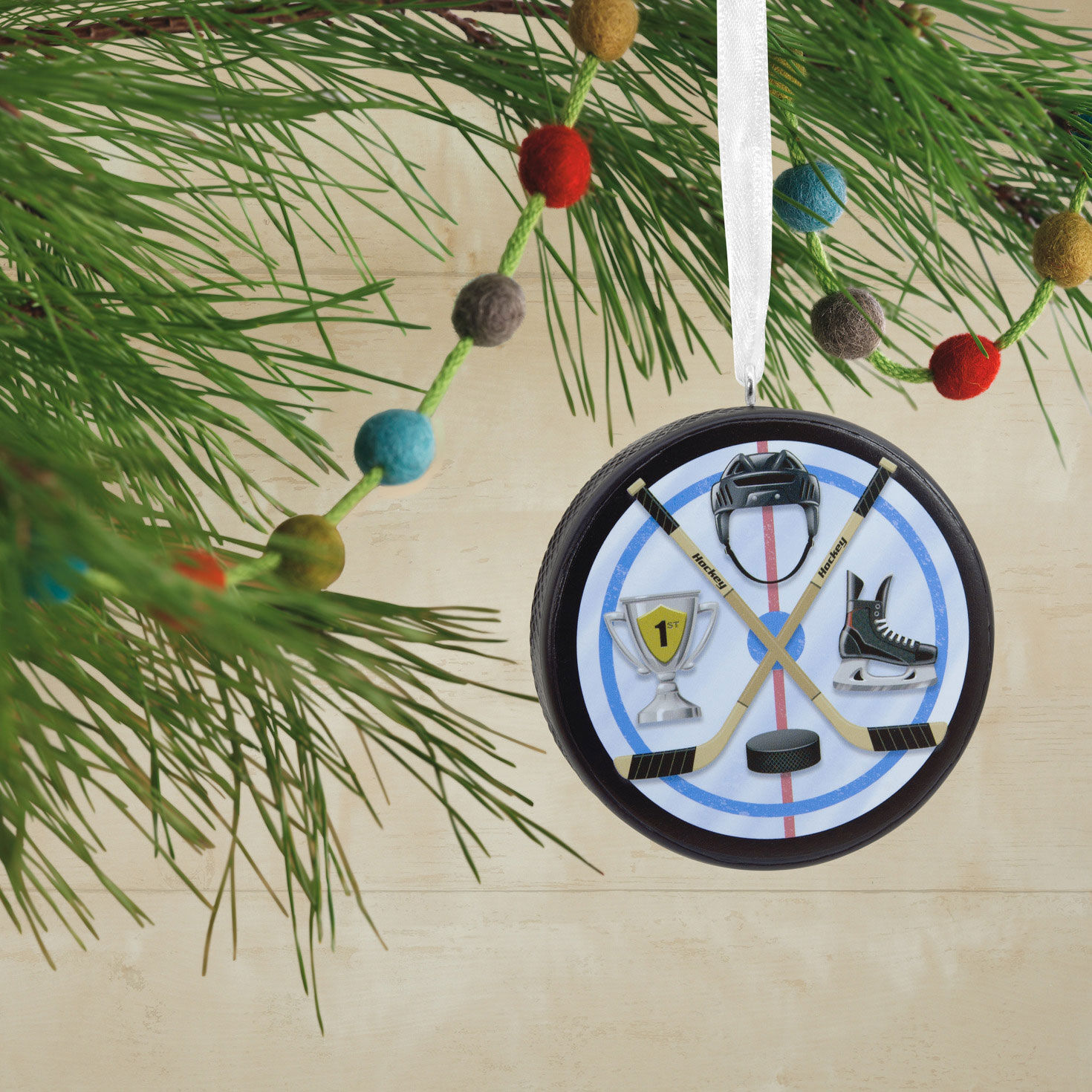 Hockey Puck Christmas Ornament hanging on tree image number 2