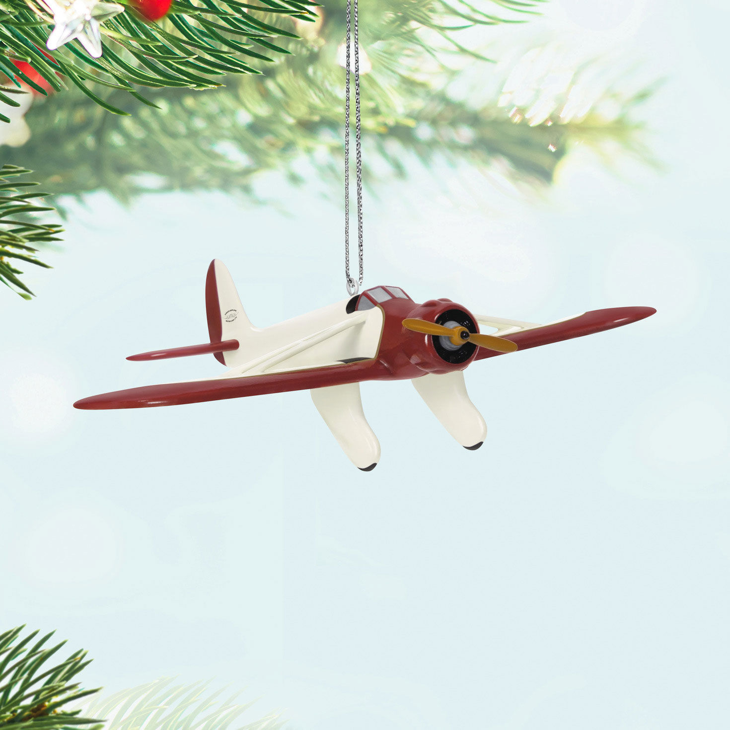 Red and White Airplane Keepsake Ornament Hanging on tree image number 2